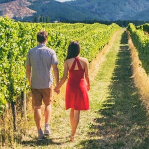 a couple walking in the vineyard