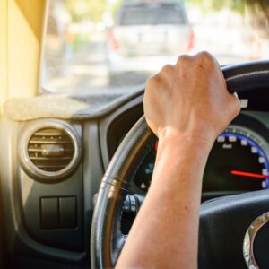 A person driving a car