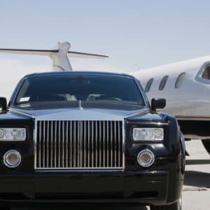 towncar next to a private jet